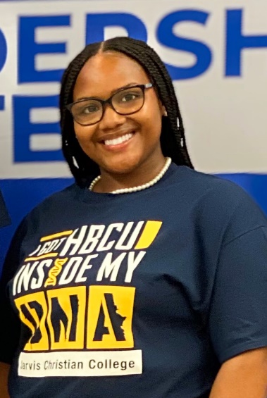 Smiling student wearing glasses